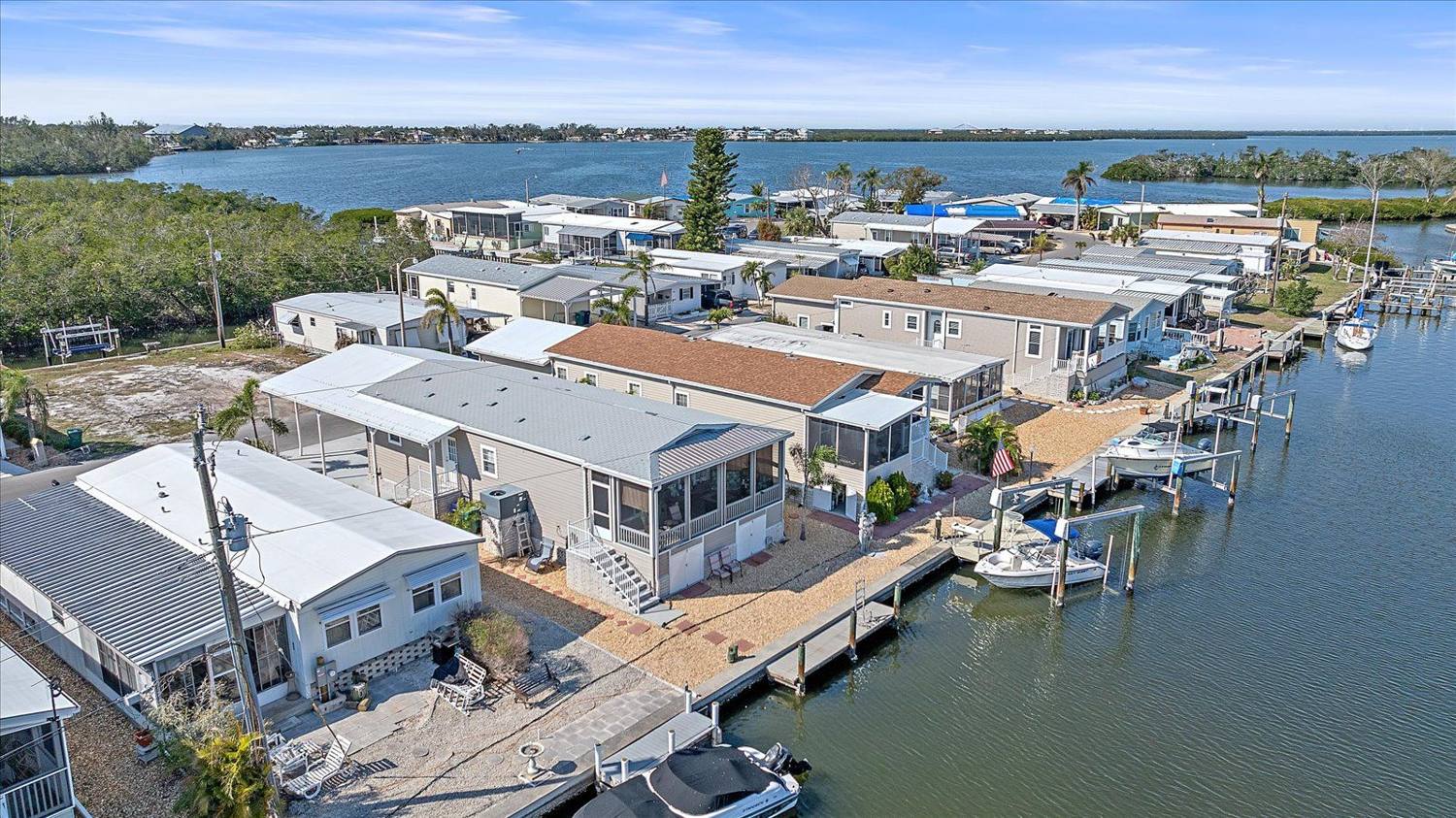Aerial view over the canals and bay at 214 Bimini Drive, Tropic Isles, Palmetto, Florida