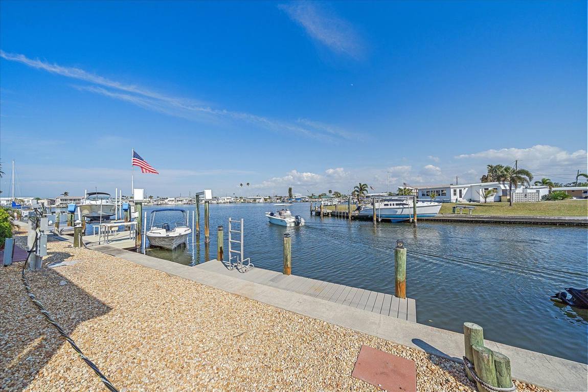 Private dock and open water behind 214 Bimini Drive