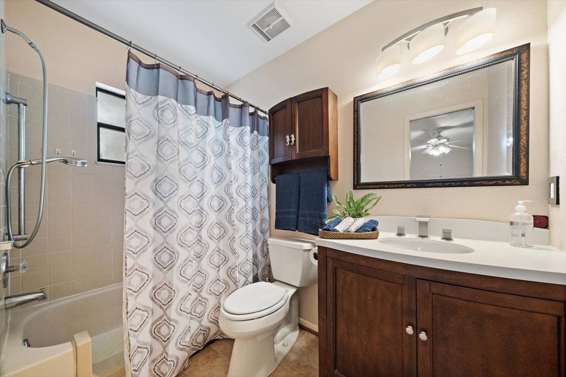 Updated bathroom with vanity and mirror