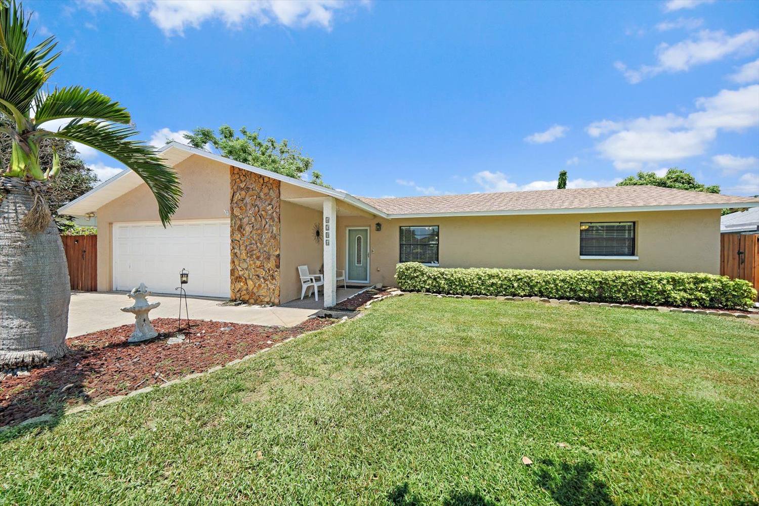 Front elevation and lawn of the sold home on Tarpon Drive SE, Lewis Island, St. Petersburg, Florida