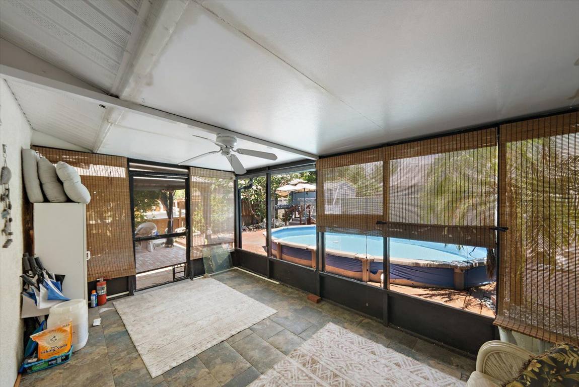 Screened lanai looking out to the pool deck