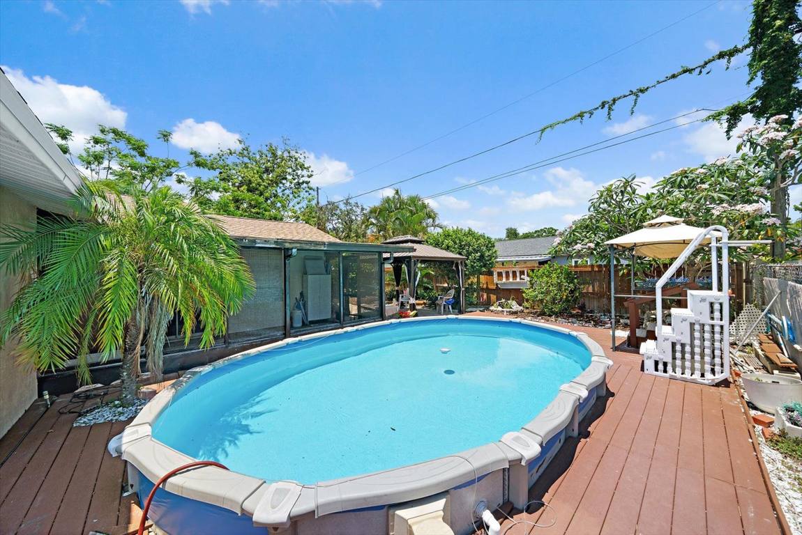 Pool and timber deck in the back yard at Tarpon Drive SE